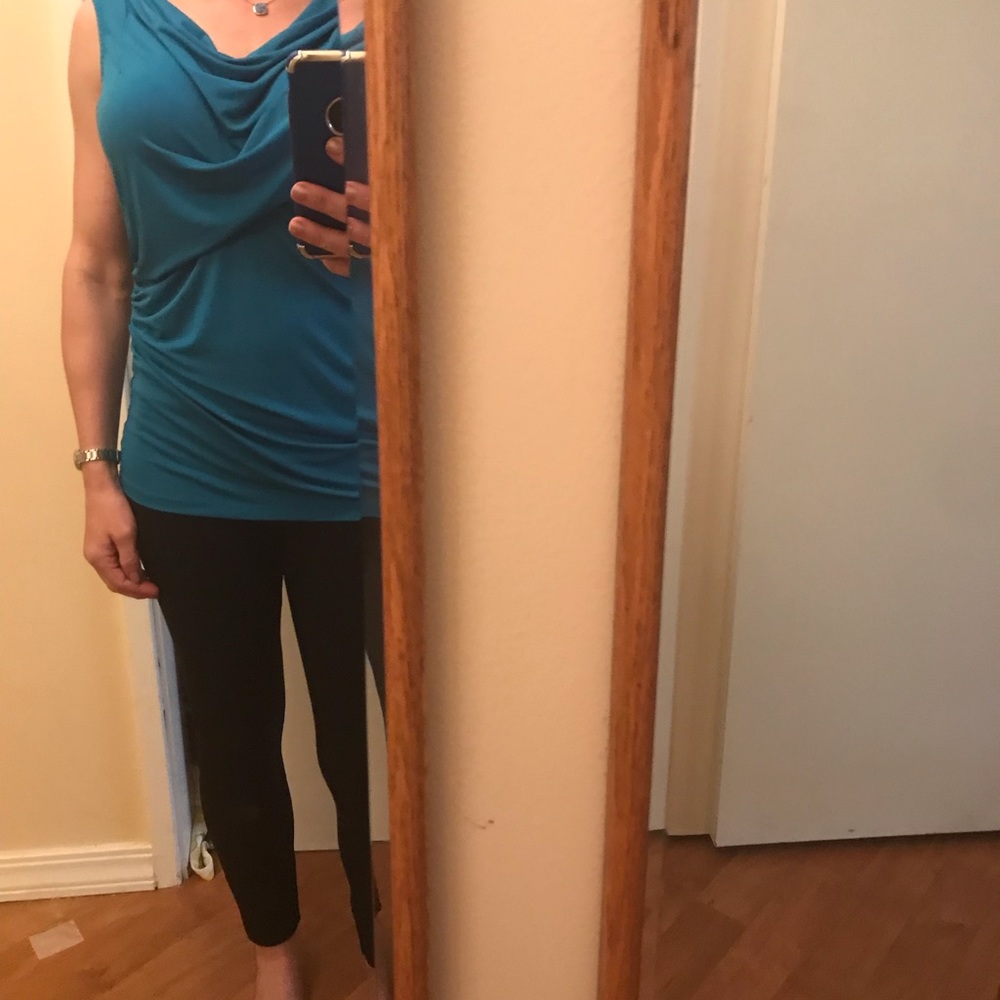 Beautiful turquoise fitted sleeveless blouse